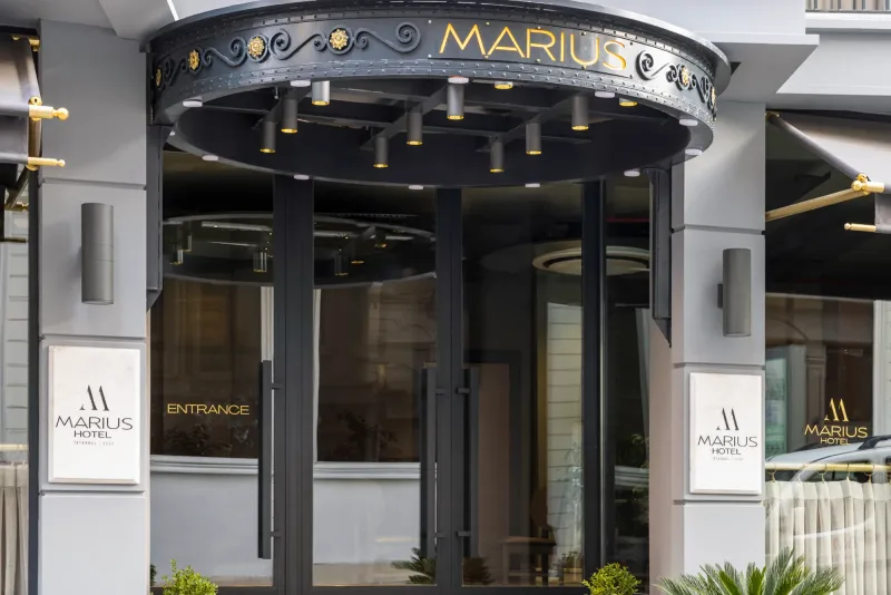 The Hotel Marius front door under the gold-lettered canopy