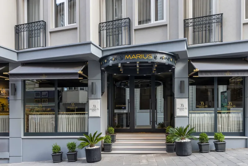 The Hotel Marius entrance with its round black canopy, by day