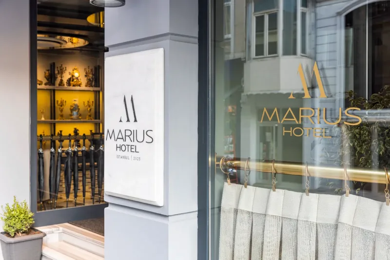 The Hotel Marius sign and lobby window on Orhaniye Avenue