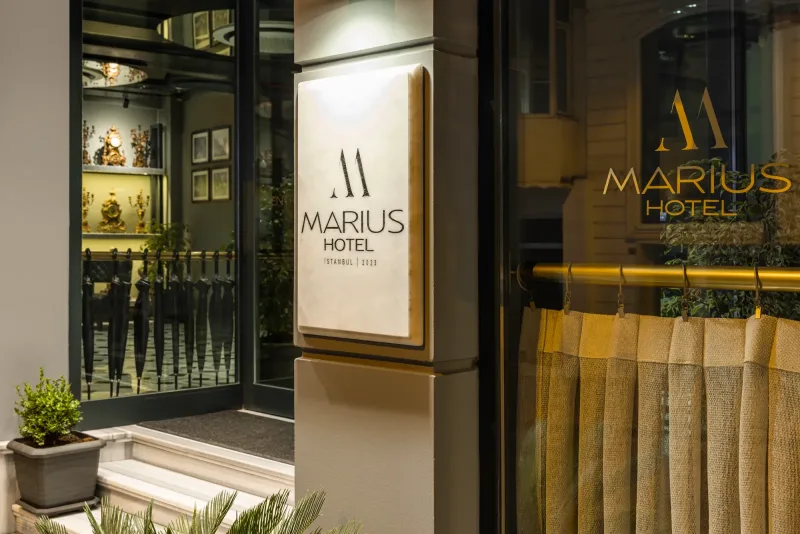 The Hotel Marius sign and lobby window on Orhaniye Avenue